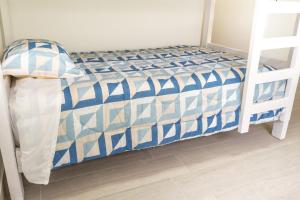 Кровать или кровати в номере Apartameno nuevo con hydro, sauna y zona BBQ