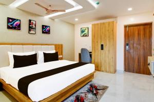 Ένα ή περισσότερα κρεβάτια σε δωμάτιο στο Super Townhouse OAK Sayhallo Sincity