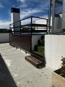 a ramp with a railing on the side of a building at depto a 1 cuadra de peatonal, luminoso con pile y cochera in Villa Carlos Paz