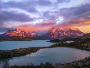 a view of a large body of water with mountains at Cabañas Frange 2 in Puerto Natales