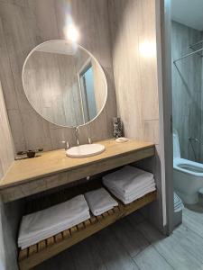 a bathroom with a sink and a mirror at Tiké in Ostende +38 photos