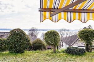 a view of a house from a tent at Seepanorama in Unteruhldingen