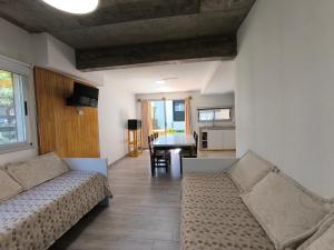 a living room with two couches and a table at Tiké in Ostende