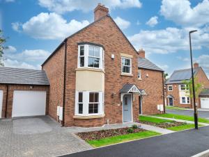 a brick house with a garage at 4 Bed House in Coventry City Centre, by ARP HOMES, Driveway & Garage, Big Garden, Ideal for Contractors, Families and Long Stays in Coventry