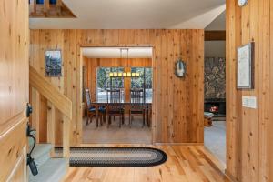 a dining room and living room with wooden walls at 14 Mt Hood in Sunriver