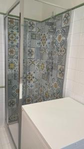 a shower with a glass door in a bathroom at Cottage love Rivisondoli by FH in Rivisondoli +17 photos