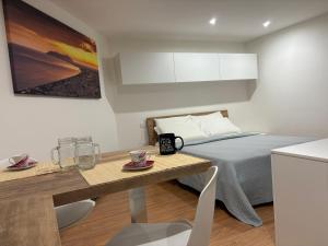 Postel nebo postele na pokoji v ubytování Anxur Apartment