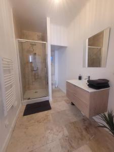 a bathroom with a shower and a sink at JMAM Urban Suite in Fos-sur-Mer