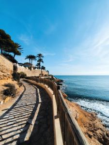 a path leading to the ocean on a beach at Cabo Roig Cristalmar in Cabo Roig