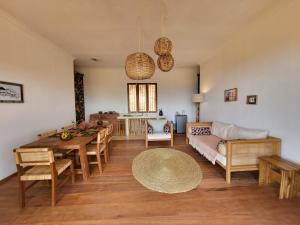a living room with a table and a couch at Hondo Hondo mountain view in Lushoto