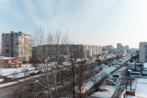 a view of a city with snow covered roads and buildings at Standard 1-bd Apartment LAVINA in Sumy