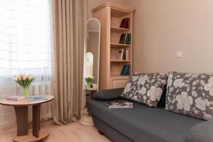 a living room with a couch and a table at Standard 1-bd Apartment LAVINA in Sumy