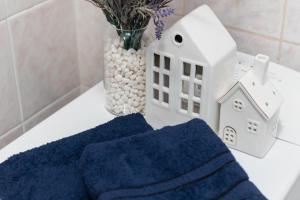 a white house and a blue towel on a table at Standard 1-bd Apartment LAVINA in Sumy +39 photos