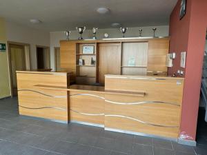 a room with wooden dividers in a room at Hotelleria di Ovada in Ovada