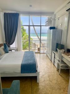 Ένα ή περισσότερα κρεβάτια σε δωμάτιο στο Smeralda Beach Hotel