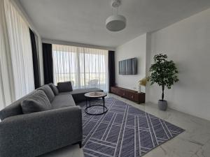 Posezení v ubytování Grand Sapphire Resort Luxury Two Bedroom Apartments