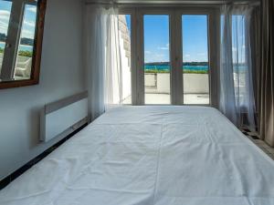 Postel nebo postele na pokoji v ubytování Vue d’Azur à Locquirec