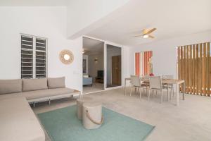 a living room with a couch and a table at Kasa Blou in Kralendijk