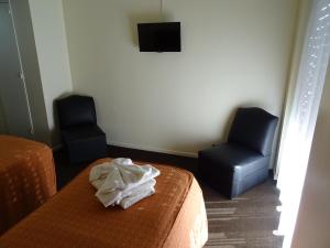 Säng eller sängar i ett rum på Hotel Plaza Roma