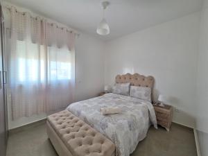 Ένα ή περισσότερα κρεβάτια σε δωμάτιο στο Superbe appartement avec une vue panoramique sur piscine +18 φωτογραφίες