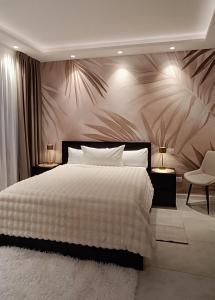 Ένα ή περισσότερα κρεβάτια σε δωμάτιο στο Dom City Apartments