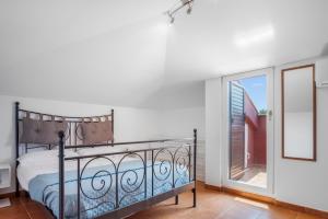 En eller flere senge i et værelse på GardenHouse Frascati