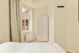 Ένα ή περισσότερα κρεβάτια σε δωμάτιο στο Modern 1BR in heart of old town