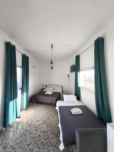 Postel nebo postele na pokoji v ubytování Liberal Gazi