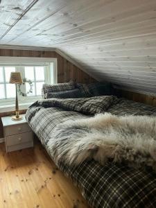 Postel nebo postele na pokoji v ubytování Panoramic Cabin With Fjord Views In Valldal + 18 fotografií