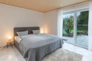 Postel nebo postele na pokoji v ubytování Ferienhaus Deichliebe