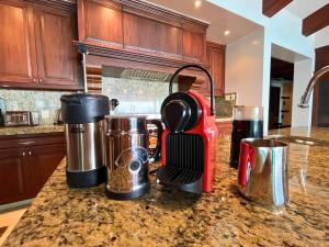 a kitchen counter with a blender on a counter top at Luxury Oceanfront Penthouse Concierge Cook in Punta Mita