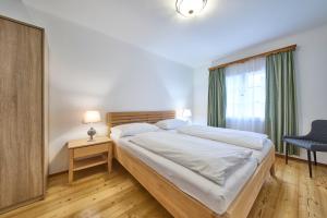 Ένα ή περισσότερα κρεβάτια σε δωμάτιο στο Ferienwohnung Salzafeld