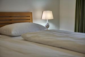 Ένα ή περισσότερα κρεβάτια σε δωμάτιο στο Ferienwohnung Salzafeld