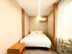 Ένα ή περισσότερα κρεβάτια σε δωμάτιο στο Platinum Selection Hotel 7x24Airport pick-up and drop-off