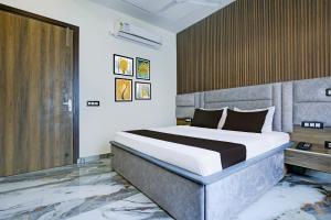 Ένα ή περισσότερα κρεβάτια σε δωμάτιο στο Hotel O Platinum