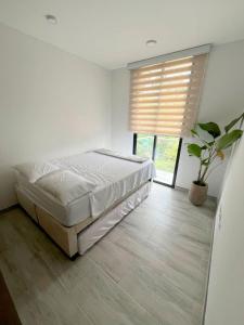 Giường trong phòng chung tại Apartamento Dulce Villeta