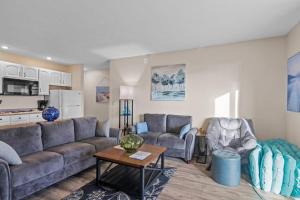 a living room with a couch and chairs and a table at Torch Lake Vista A-Ga-Ming Golf Retreat 741 in Creswell