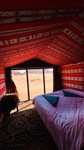 Ένα ή περισσότερα κρεβάτια σε δωμάτιο στο Desert Nights camp