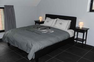 Voodi või voodid majutusasutuse Gîte Fenêtres sur cour - Genappe toas