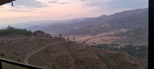 a view of a mountain with a road on it at Lalibela Circle Guest House in Lalibela