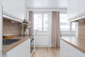 Kuchyň nebo kuchyňský kout v ubytování City Pearl II