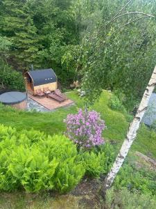 an aerial view of a garden with a gazebo at Botanisk Spa-retreat - Badstue & Foss - Magisk sted in Vossevangen