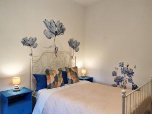 Ένα ή περισσότερα κρεβάτια σε δωμάτιο στο Fiori e Frutti Guest Home