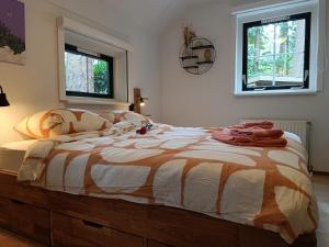 Ένα ή περισσότερα κρεβάτια σε δωμάτιο στο Rustig Boshuis Lunteren, Veluwe, Tuin en Haard +93 φωτογραφίες