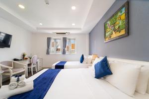 Postel nebo postele na pokoji v ubytování Sabina Residence