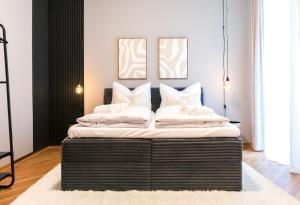 Ένα ή περισσότερα κρεβάτια σε δωμάτιο στο Maison & Mood Apartments Colditz I Design Studios
