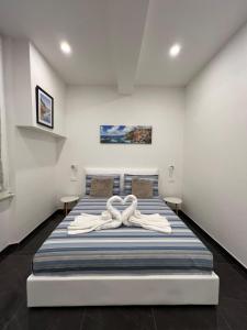 Ένα ή περισσότερα κρεβάτια σε δωμάτιο στο Onda di mare