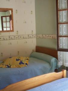 Ένα ή περισσότερα κρεβάτια σε δωμάτιο στο Gite Coumély