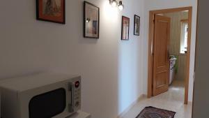 TV a/nebo společenská místnost v ubytování Casa da Alegria Boutique Guest Suite