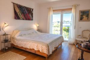 Ένα ή περισσότερα κρεβάτια σε δωμάτιο στο Casa da Alegria Boutique Guest Suite